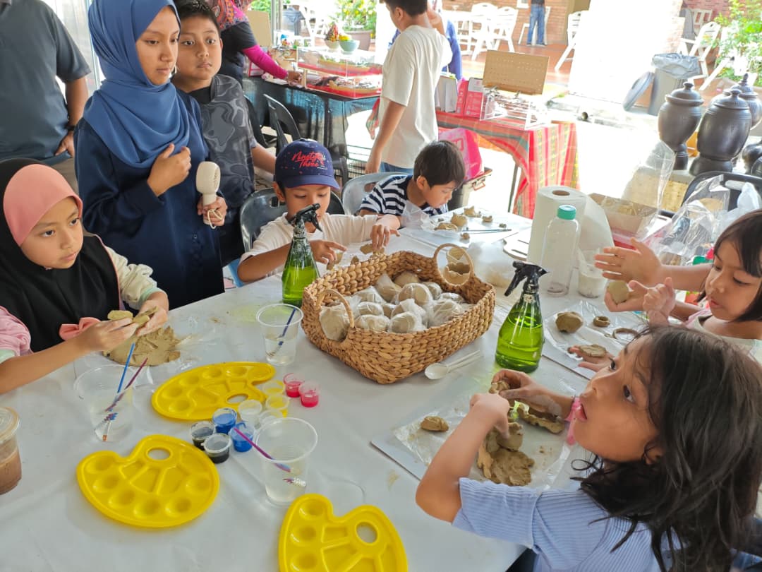 The Ruang Karya market booth with ceramic pieces set out for visitors